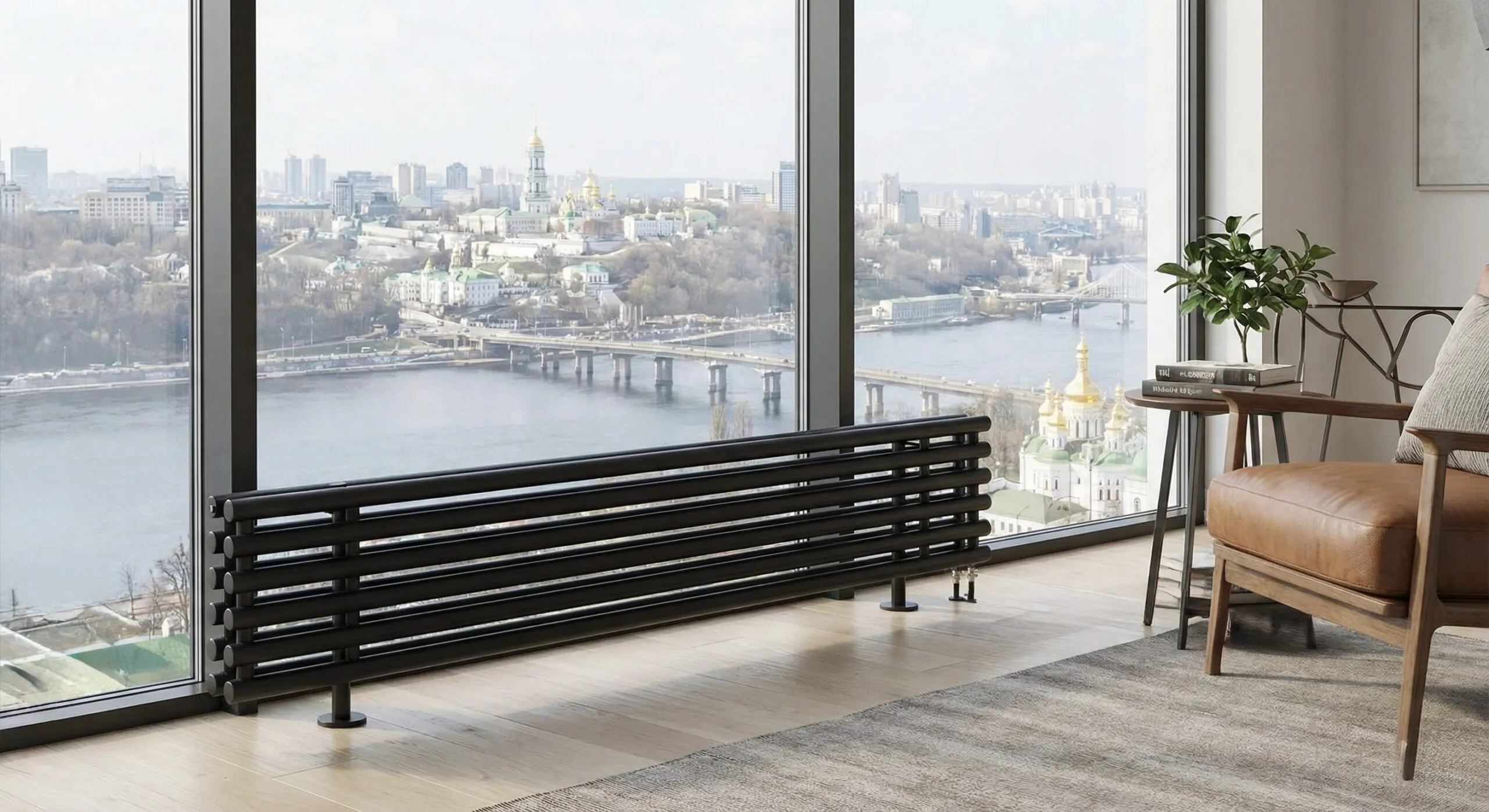 Низький радіатор опалення на ніжках біля панорамного вікна.